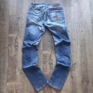 Britos Jeans Distressed Fleur-De-Lis Embroidered Skinny Jeans